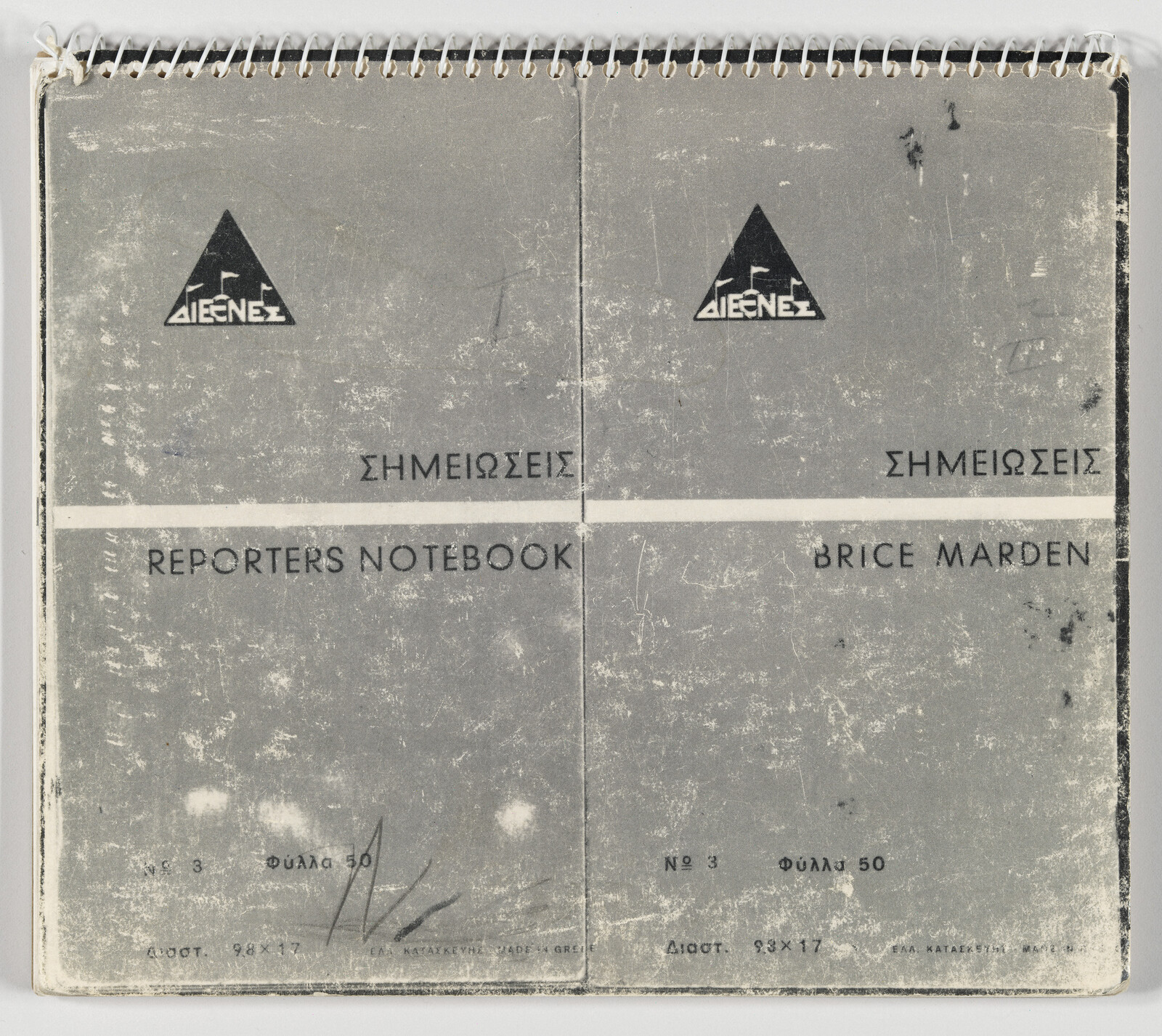Worn spiral-bound reporter's notebook cover labeled Reporter’s Notebook and Brice Marden.