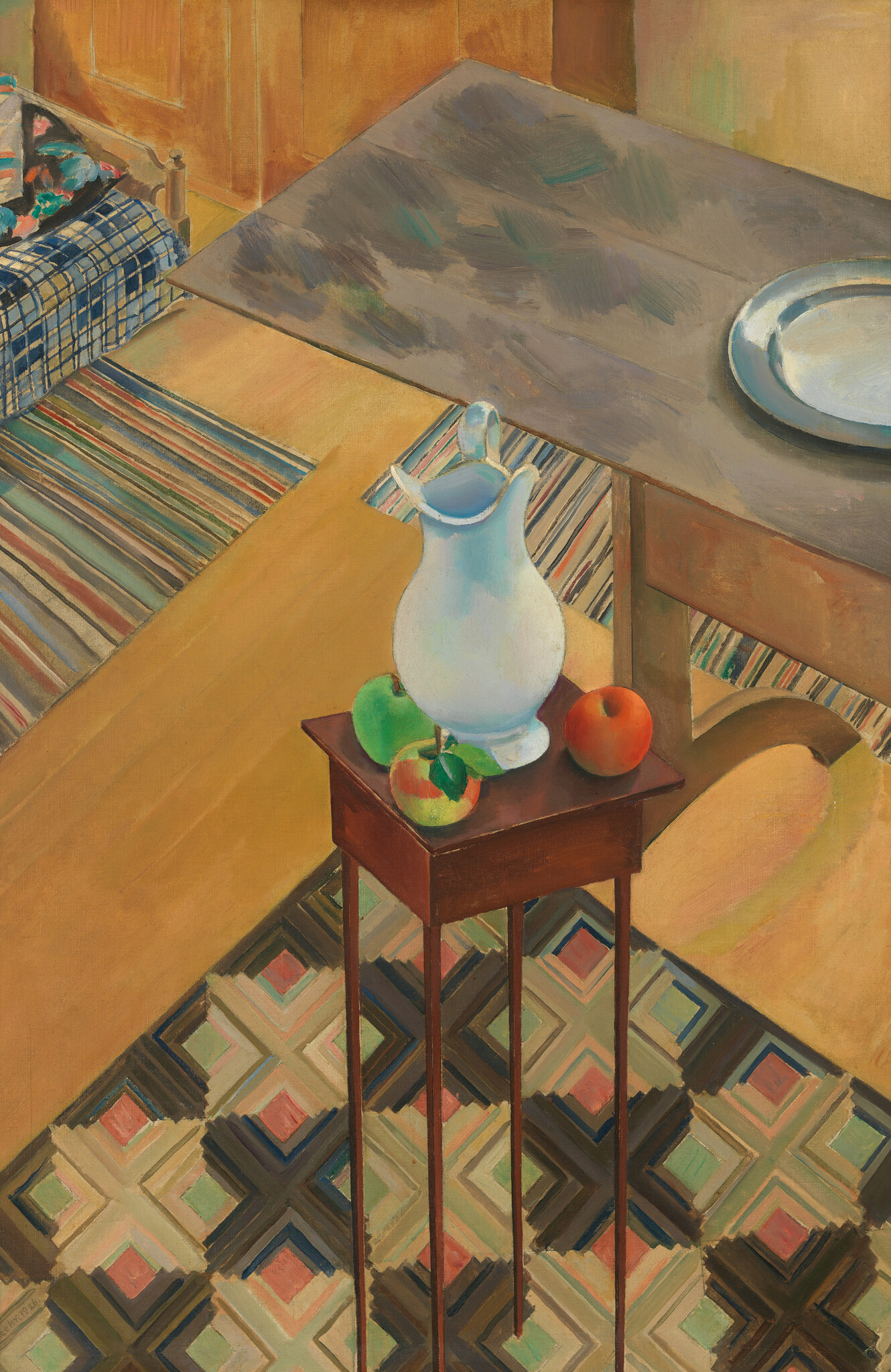 A tall narrow table holds a white pitcher and three apples in a patterned room.