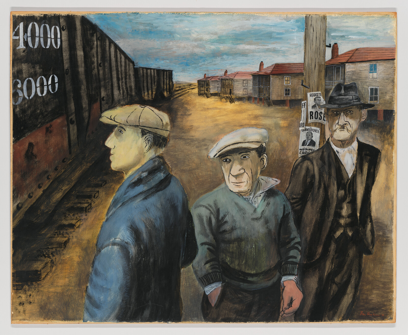 Three men stand by a freight train and tracks in a dusty, rundown neighborhood.
