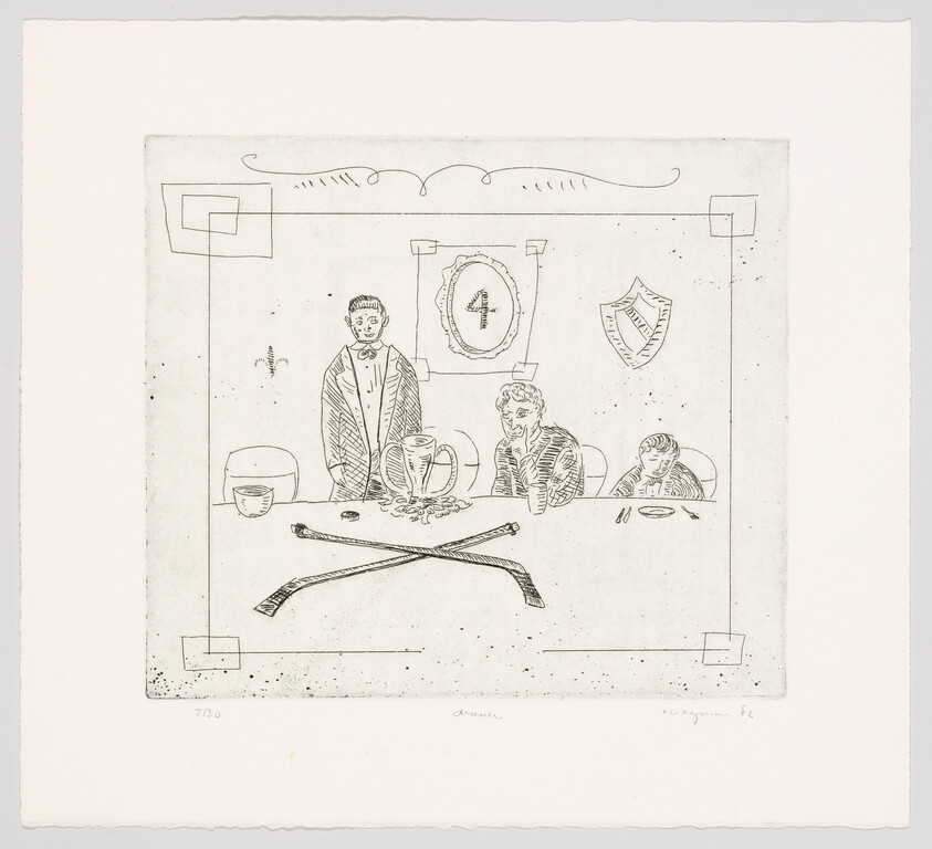 Three people sit at a table with a trophy and crossed clubs while one person stands.