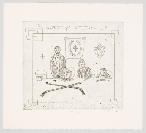 Three people sit at a table with a trophy and crossed clubs while one person stands.