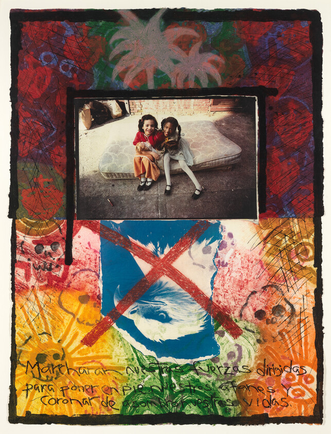 Two young girls sit on an outdoor mattress smiling, above a colorful collage marked with a red X.