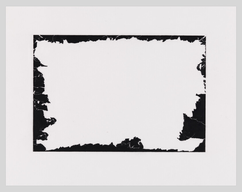 A white rectangular sheet with irregular torn black border fragments forming a rough frame.