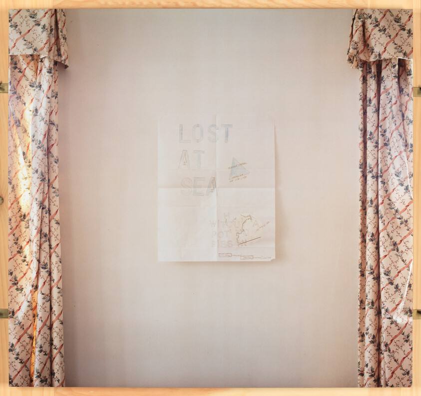 A faded poster reading "LOST AT SEA" hangs on a plain wall between patterned curtains.