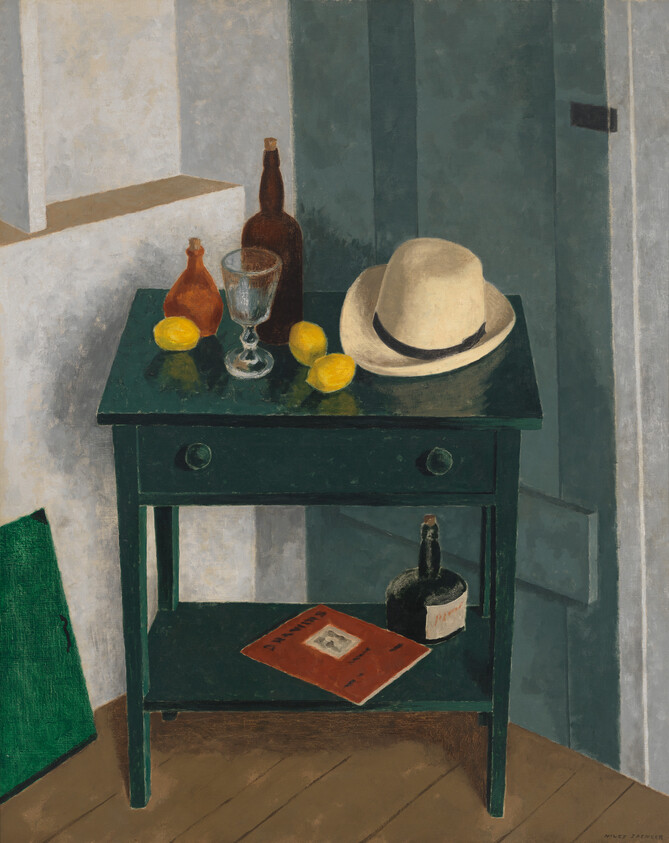 A green table holding a straw hat, glass, bottles, and lemons, with a book and bottle below.
