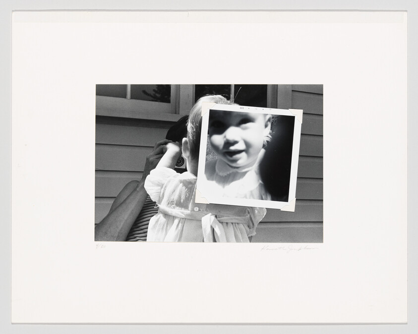 A toddler is held by an adult while a close-up photo covers the child's face.