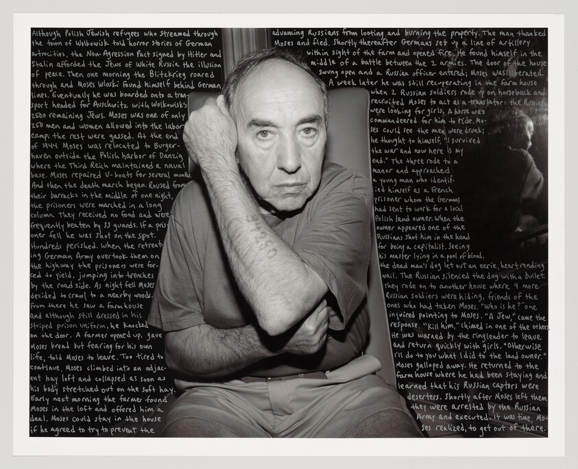 A man has his has right arm cut across his chest to show the number he was assigned during the holocaust