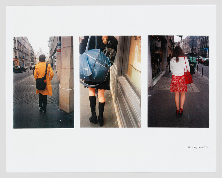 Three women walk away along a city sidewalk, each wearing different coats and carrying bags.
