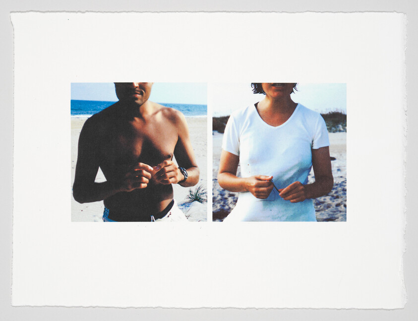 A photograph of two people on a beach, with the image cut in half and mismatched; the left side shows a shirtless man from the neck to the waist, and the right side shows a woman in a white t-shirt from the neck to the waist. The background features a clear sky and the ocean horizon. The photo has a white border with rough edges, suggesting it may be a Polaroid or printed photo.