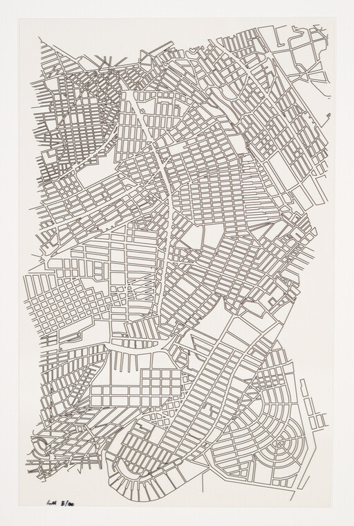Stylized monochrome city street map showing dense grid blocks and curving waterfront roads.