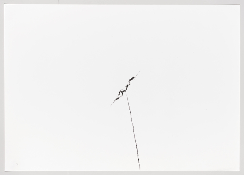 A minimalist image showing a single, thin, jagged crack running diagonally across an otherwise blank white surface.