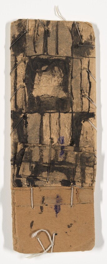 Tall torn cardboard with black ink grid and white thread stitches.