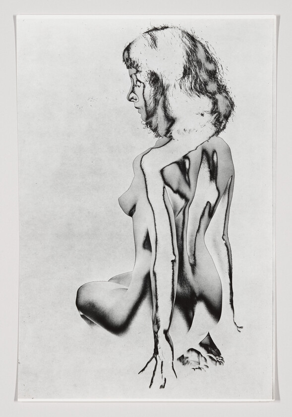 Nude woman kneeling in profile with dark paint-like stripes running down her body.