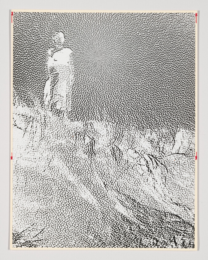 A solitary figure stands on a textured hill overlooking a sunburst-like patterned sky.