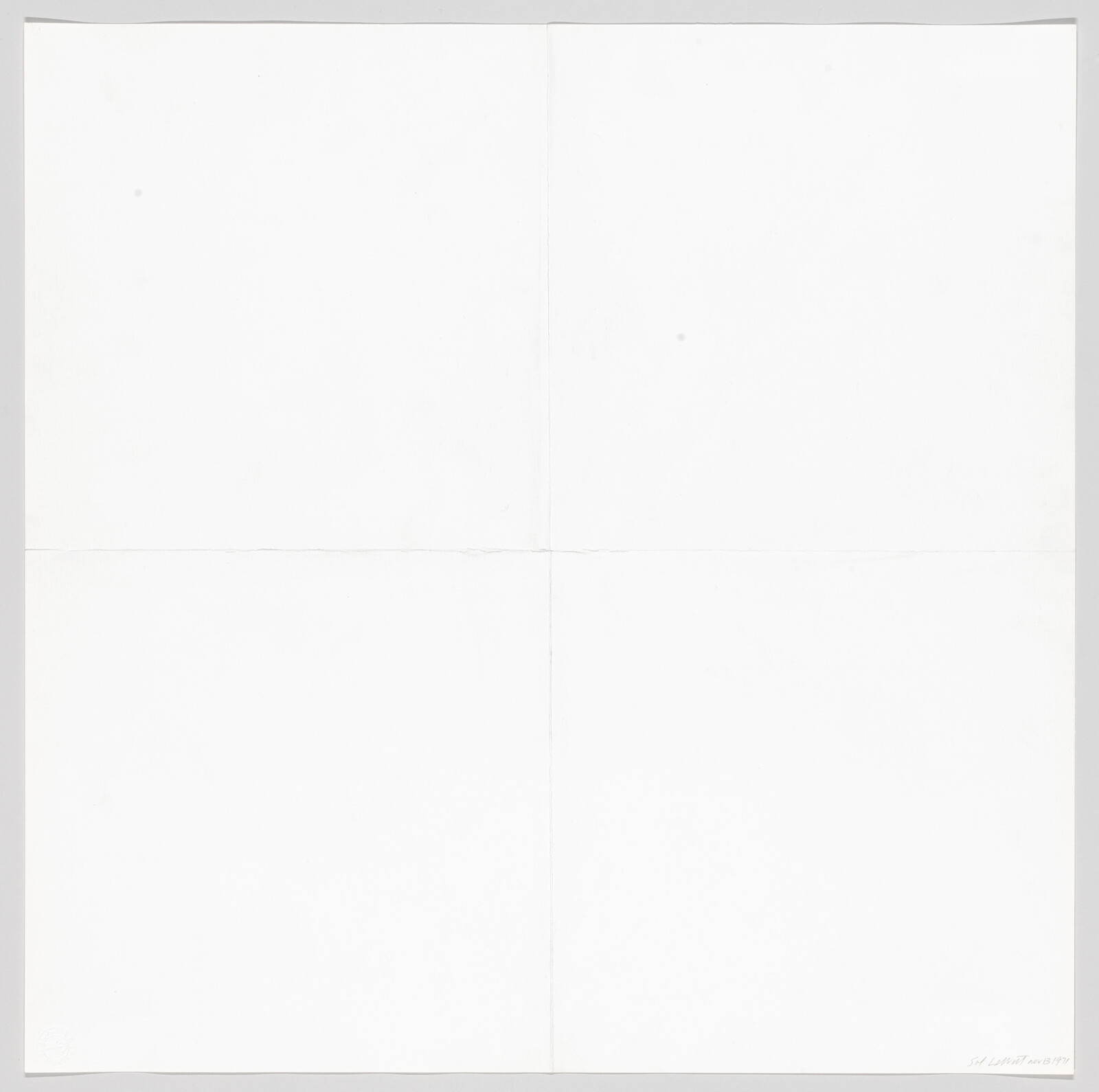 Large white sheet of paper with faint vertical and horizontal fold creases dividing it into four panels.