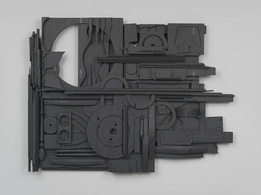 Abstract artwork with various black geometric shapes and textures arranged on a flat surface.