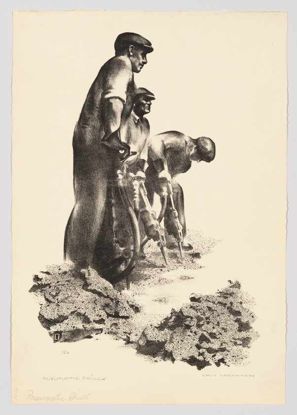 Three construction workers using pneumatic drills to break up rocky ground.