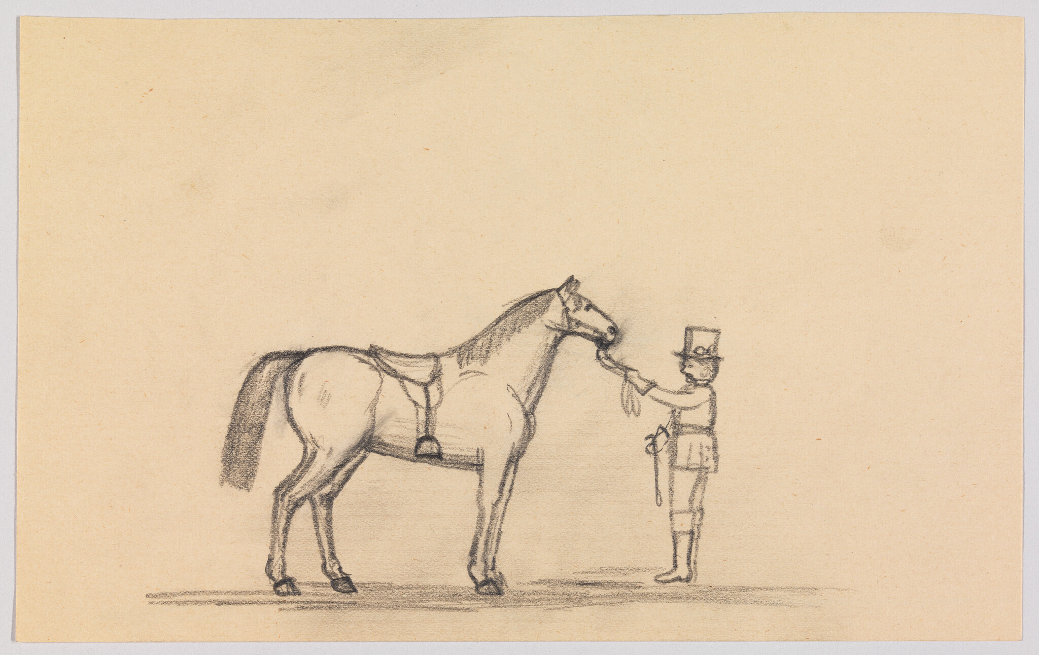 A man in a top hat stands holding a rein and offering a treat to a saddled horse.