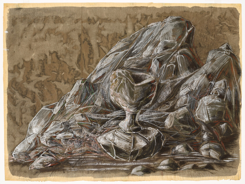 A sculpted rocky formation with a goblet-like cup resting among rough stones on a brown background.