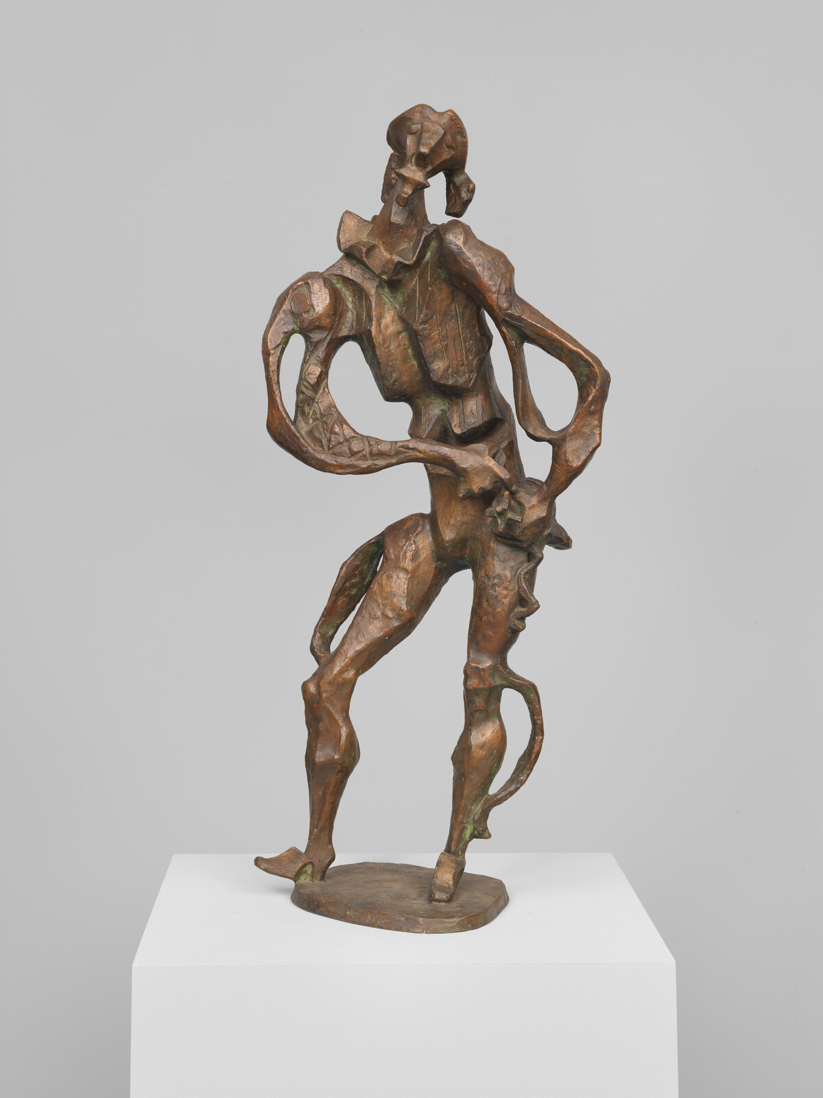 Bronze abstract figure with twisted, elongated limbs standing in a dynamic, contorted pose on a pedestal.