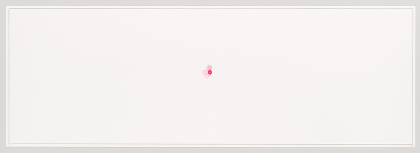 A small pink sticker sits near the center of a wide blank white panel.