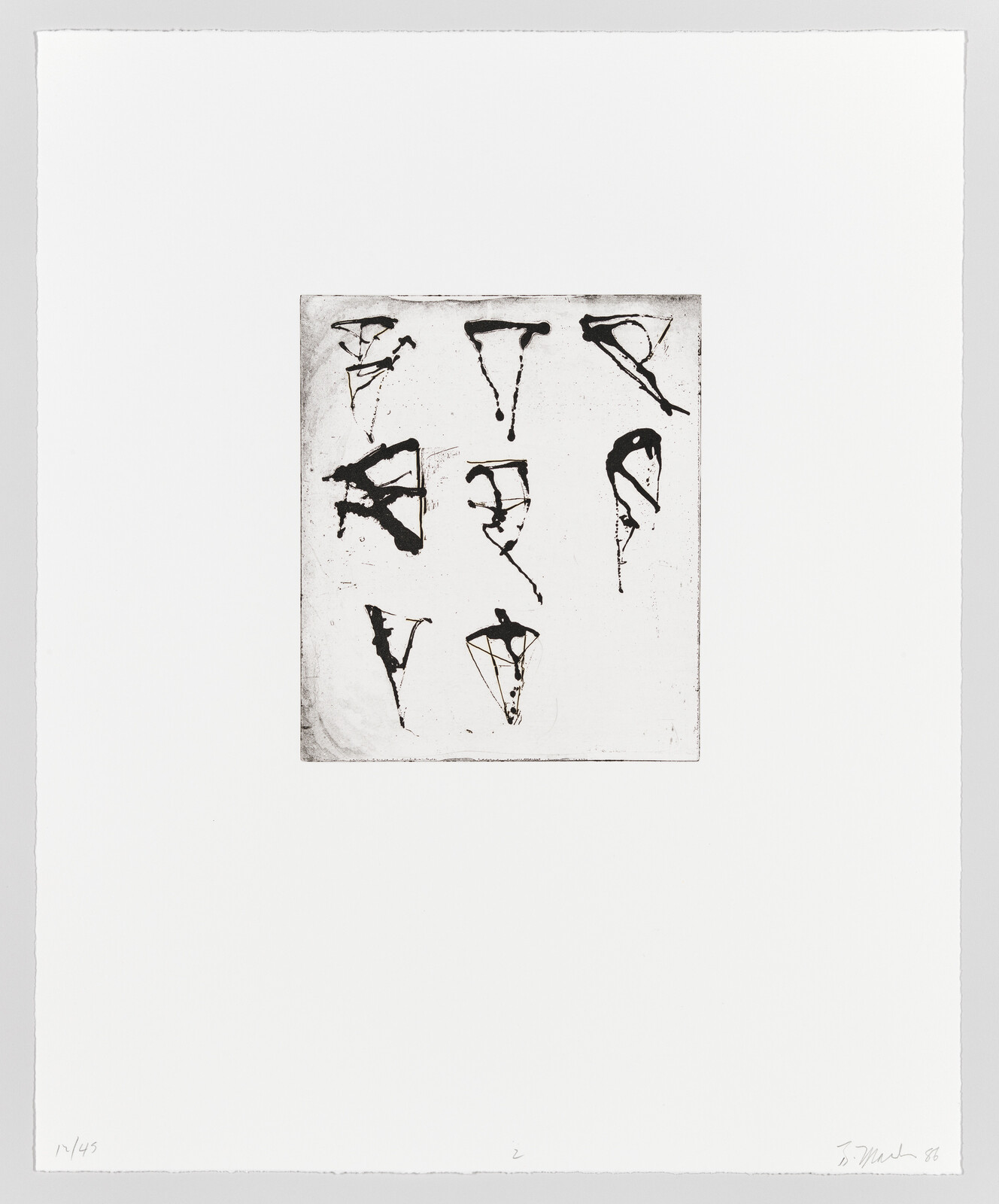 Nine abstract black ink marks arranged in a three-by-three grid on white paper.