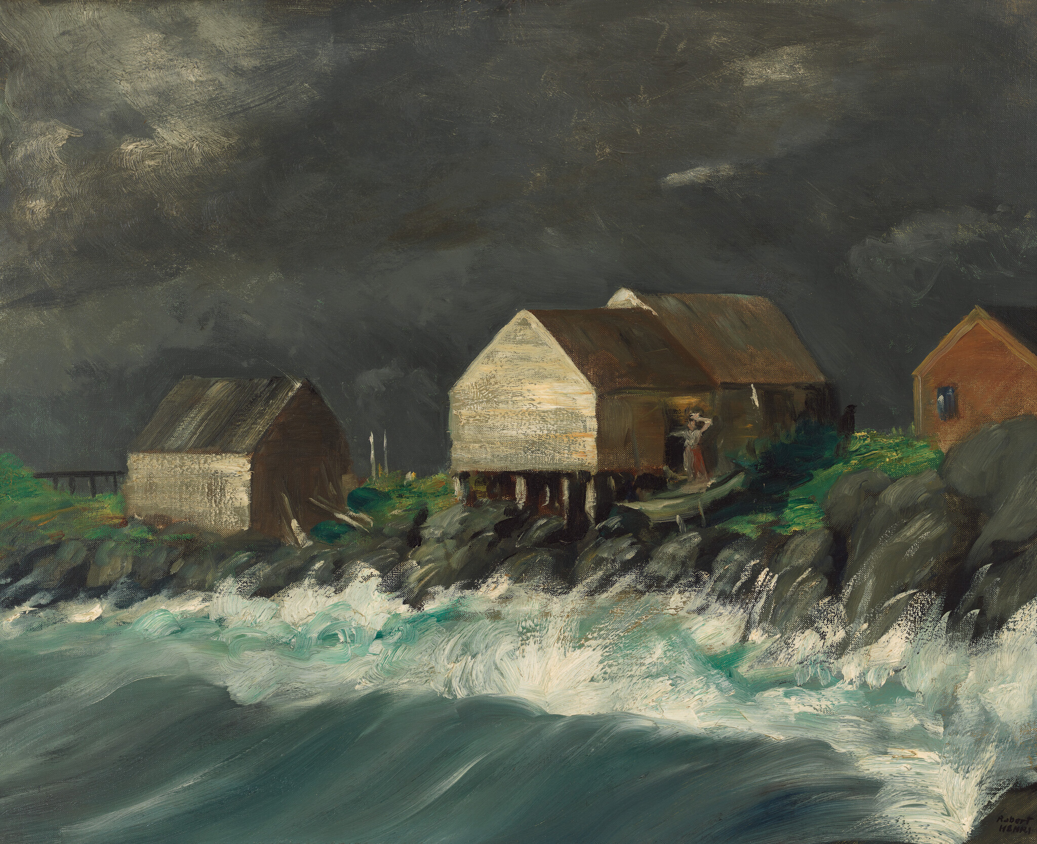 Waves crash against the rocky shore below stilted boathouses under a dark sky.