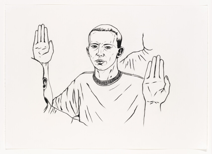 A person with short hair raises both hands forward with palms facing outward as if surrendering.