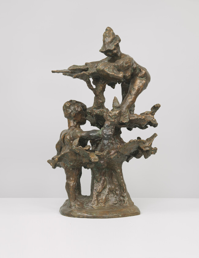 Bronze sculpture of two children climbing and playing on a stylized tree.