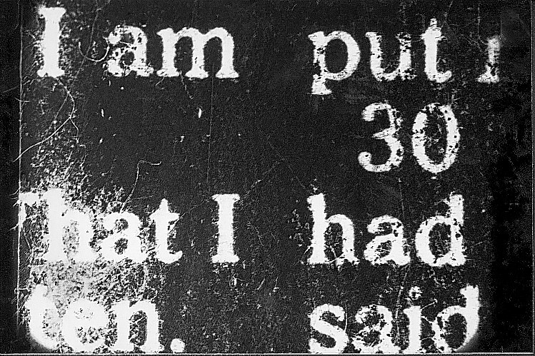 White, partially obscured text on a black background reads: "I am put 30 that I had ten. said".