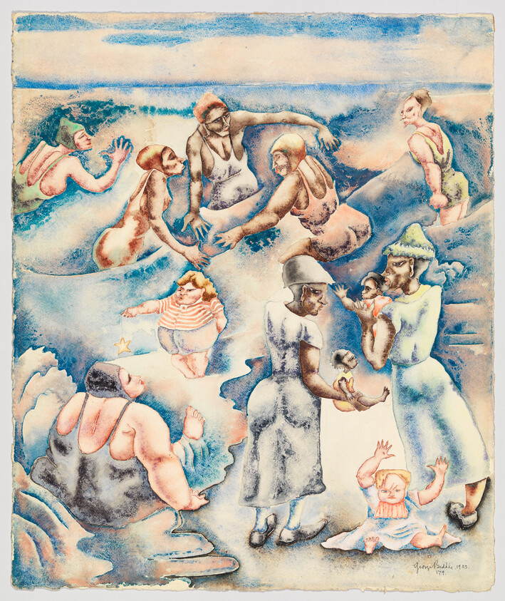 People in bathing suits playing in waves, adults holding and tending to small children.