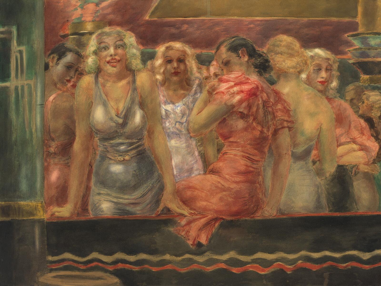 A group of women in glamorous dresses lean on a bar and chat in a crowded room.