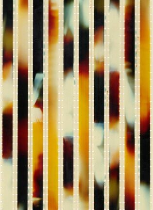 Vertical stripes with warm yellow, orange, and black bands over a blurred colorful background.