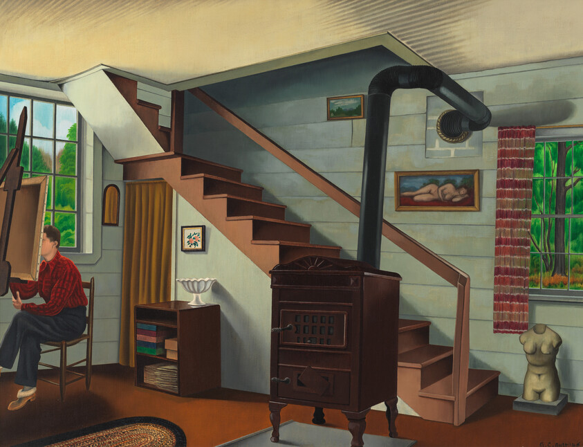 A man sits painting at an easel in a cozy room with a wood stove and staircase.