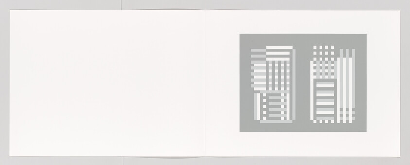 An open white booklet shows a gray page with two abstract geometric patterns of rectangles.