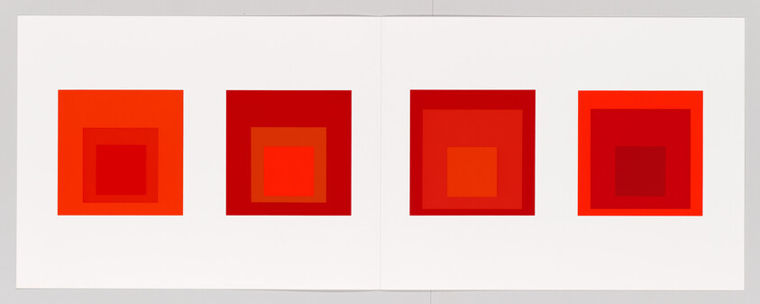 Four red nested-square artworks arranged in a row across a white two-page spread.