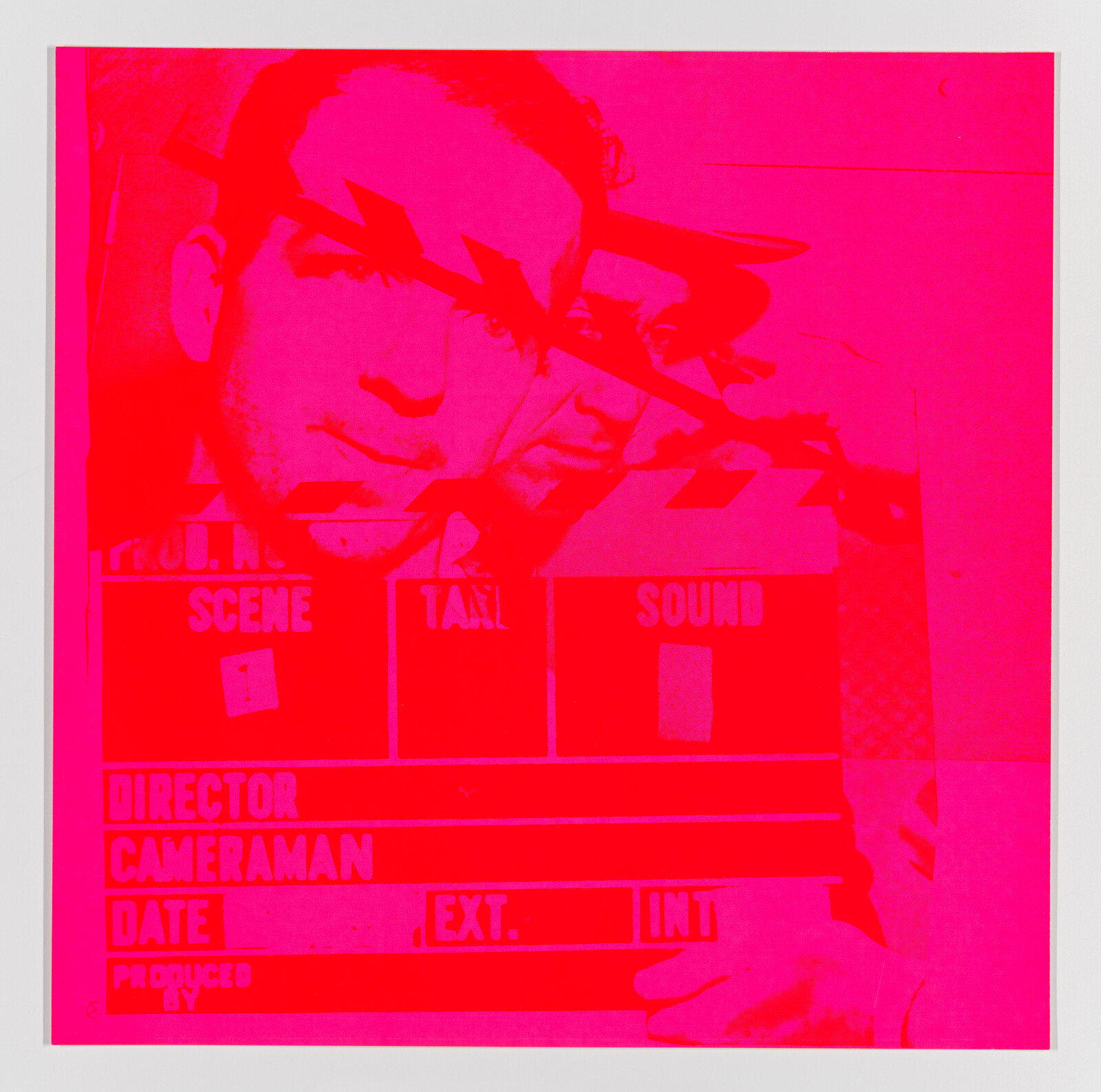 A vivid pink and red monochromatic image featuring a double exposure effect with a man's face and a clapperboard in the foreground. The text on the clapperboard includes typical film production details such as "SCENE," "TAKE," "DIRECTOR," "CAMERAMAN," but the specific information is not filled in. The overlapping visuals create an abstract and artistic composition.