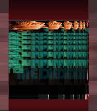 Stacked distorted hands reaching across a green and red glitch pattern.