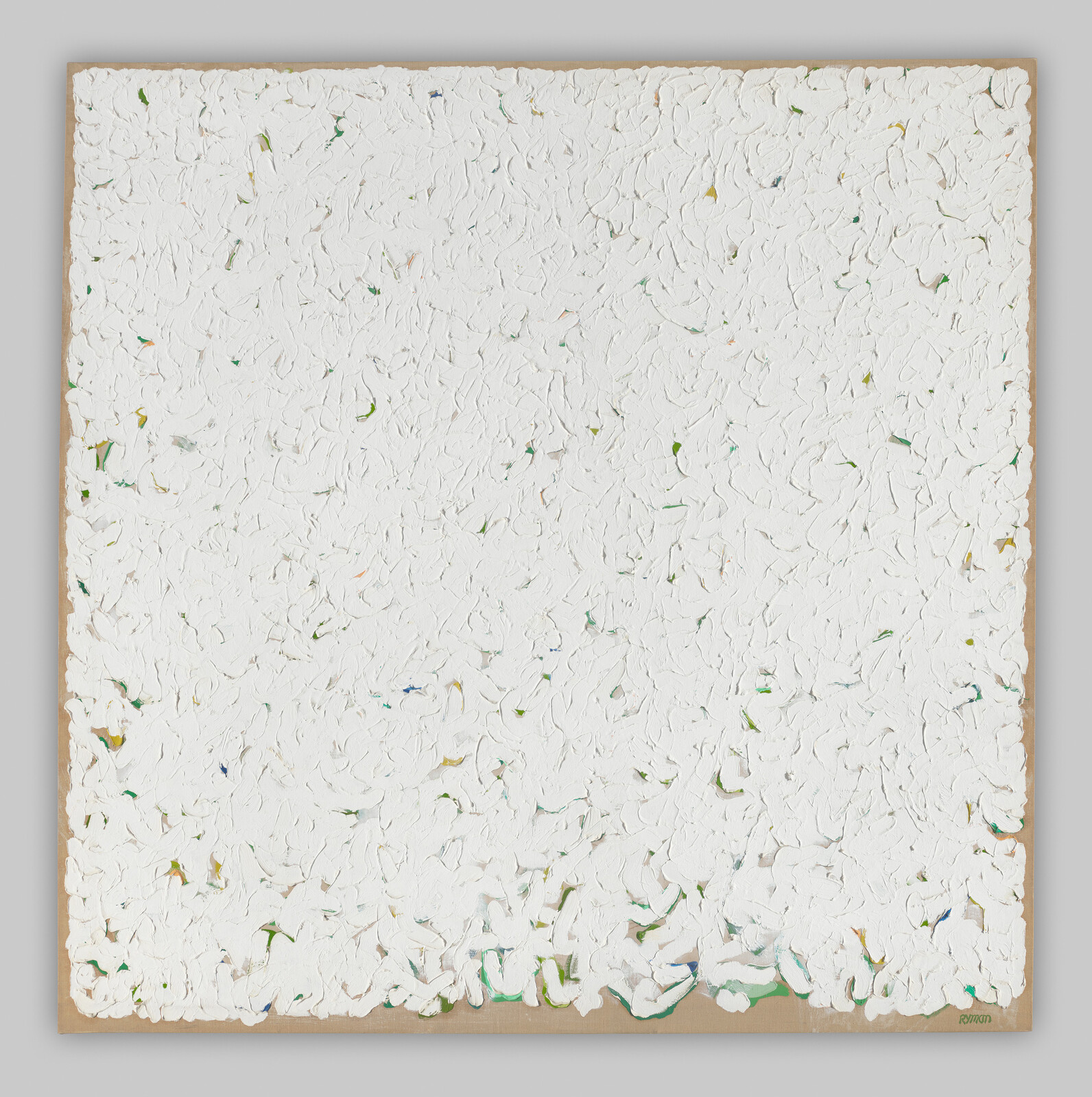 Thick white textured abstract painting with small green and blue flecks on a canvas.