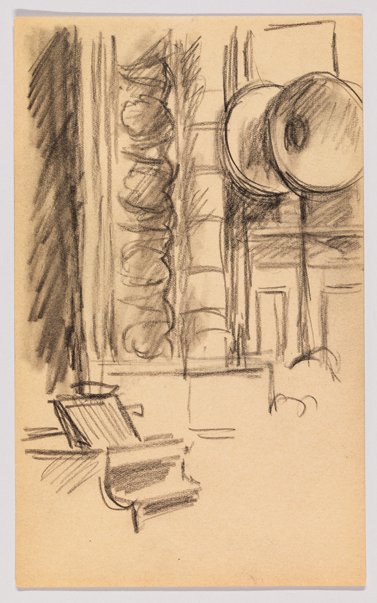 A sketch on tan paper featuring an abstract representation of an interior space with a chair in the foreground and circular shapes that could be interpreted as hanging objects or lights in the background. The drawing is executed with loose, expressive lines, primarily in black, suggesting a quick, impromptu capture of the scene.