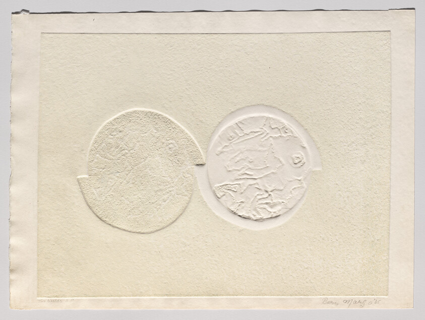 Two embossed circular shapes overlap on textured cream paper, one showing raised map-like patterns.