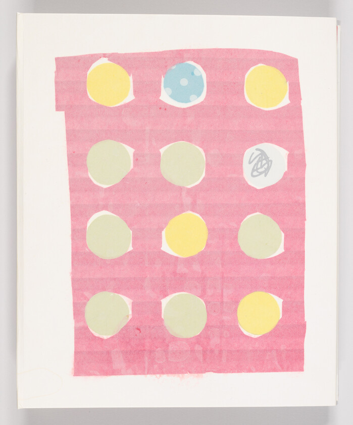 Pink rectangular sheet with a three-by-four grid of colored circular stickers, one with scribble.