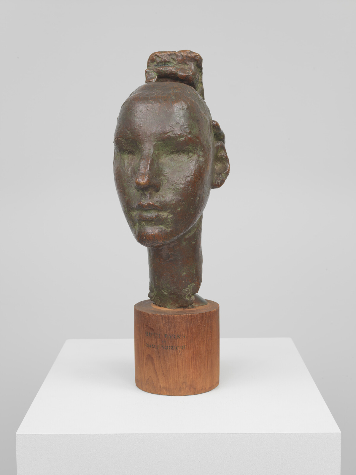 A head with eyes closed and an abstract mass emerging from behind