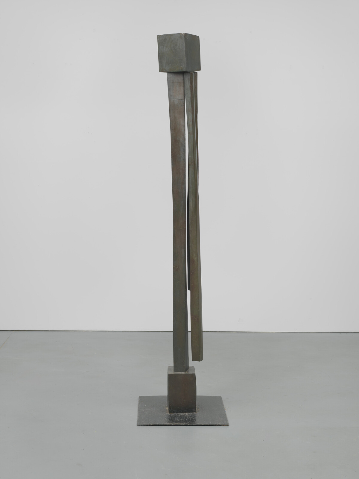 Two long, irregular rectangles vertically sandwiched between two cubes.