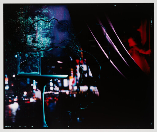 A ghostly blue face and a glass cube hover above a neon-lit cityscape at night.