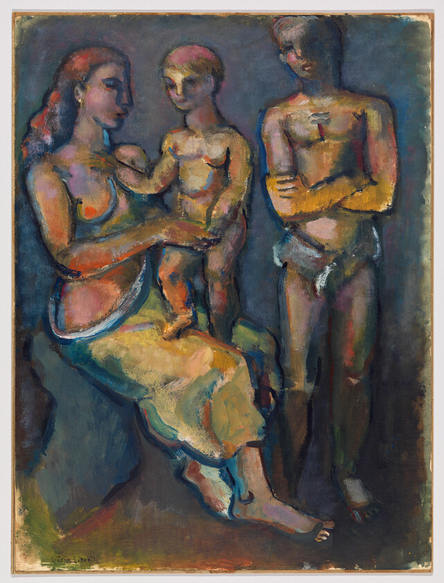 A seated woman holds a young child while a man stands nearby with crossed arms.