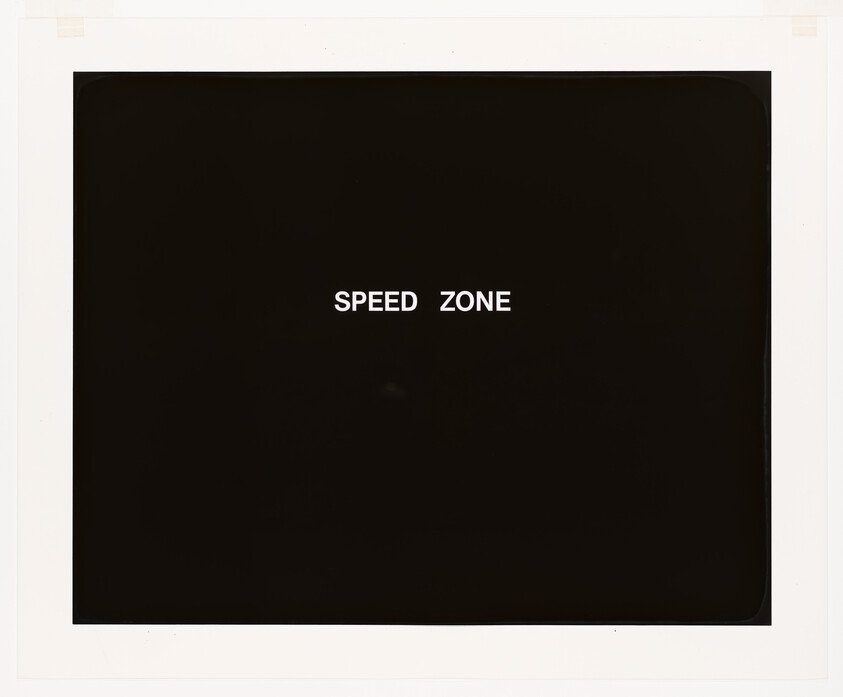 A photograph with a black background and the words "SPEED ZONE" in white text centered in the image, surrounded by a white border.