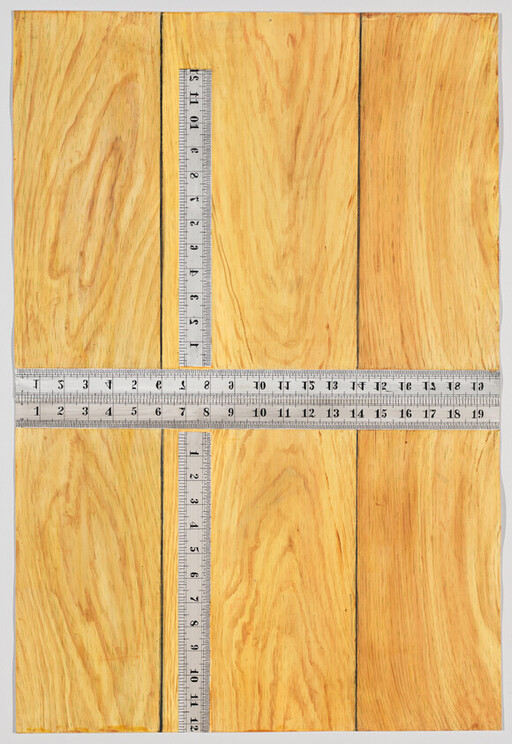 Three wooden panels with two metal rulers forming a cross across the surface.