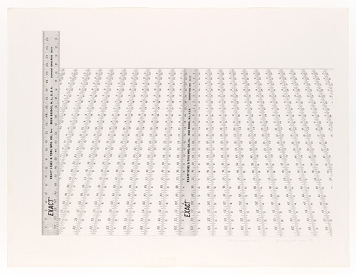 Two metal rulers arranged in an L over a grid of repeating measurement markings.