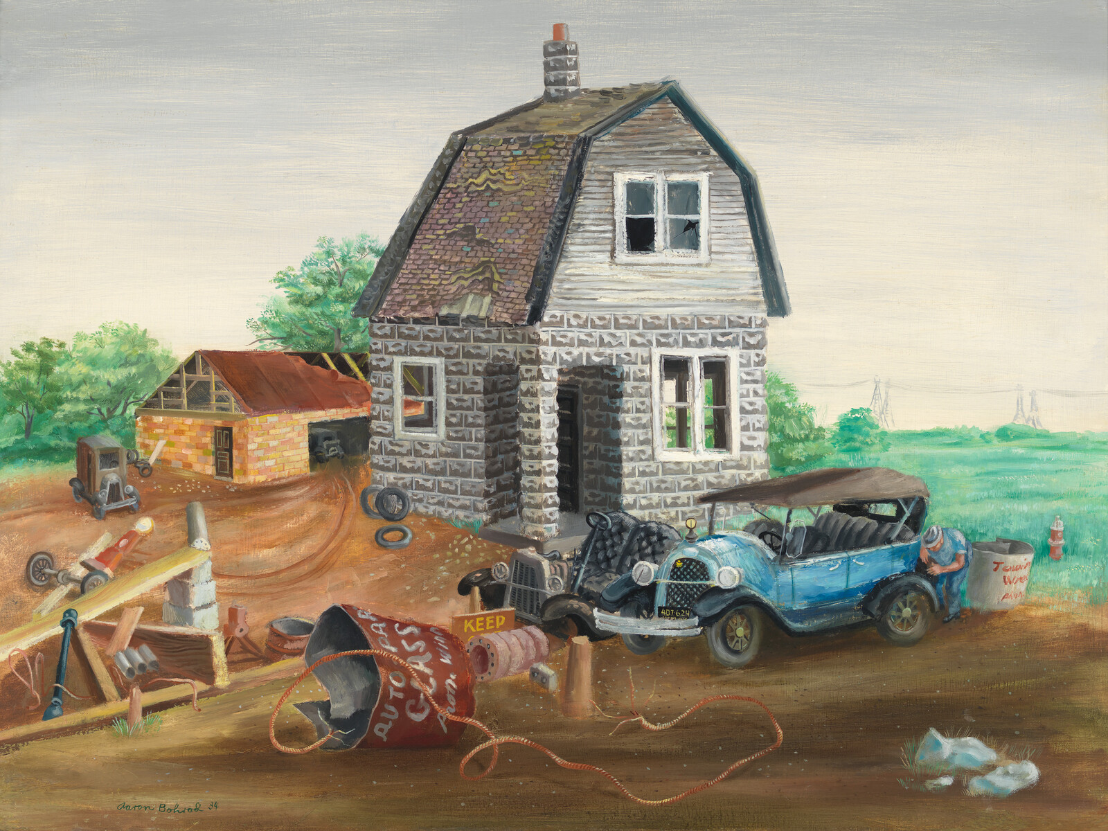 A dilapidated country house with a mechanic fixing an old blue car amid scattered junk.